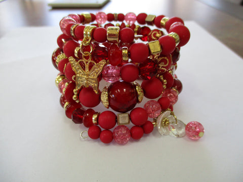Multi Red Beads Glass Beads, Gold Beads. Flower, Butterfly Charms Memory Wire Bracelet (B654)